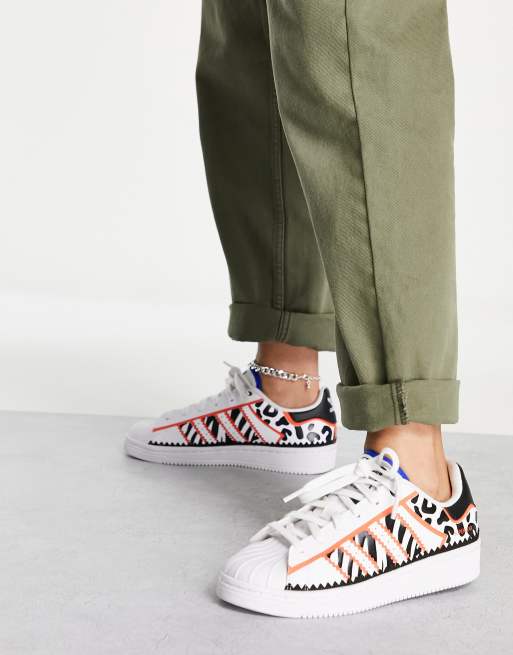 adidas Originals Superstar tech sneakers with animal print in white