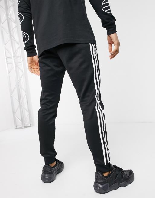 Adidas originals superstar skinny joggers cuffed in hot sale black cw1275