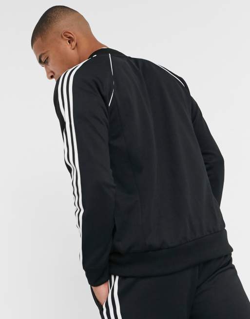 Black adidas track jacket with 2024 gold stripes