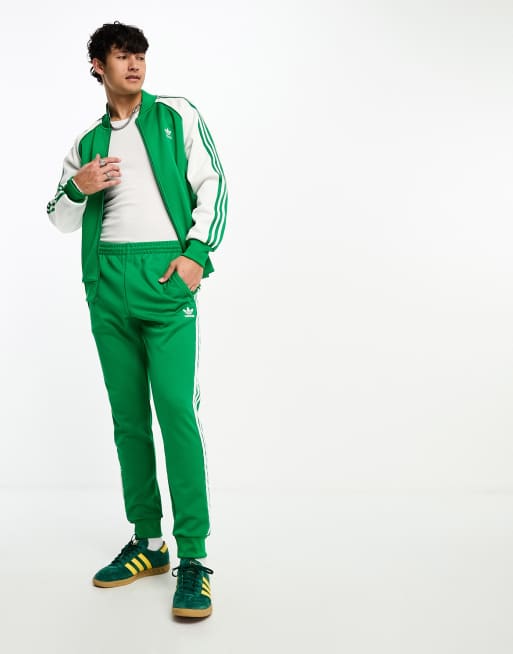 Adidas originals superstar green hotsell track top