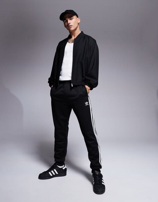 Adidas superstar best sale track pants black