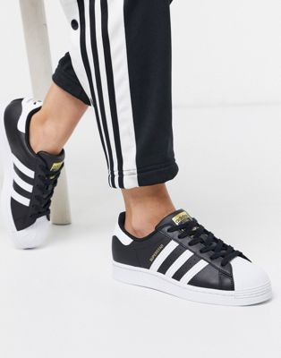 adidas Originals Superstar trainers in black and white