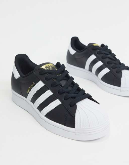 adidas Originals Superstar trainers in black and white