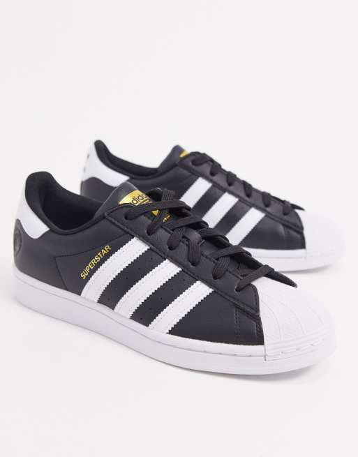 adidas Originals Superstar trainers in black and white