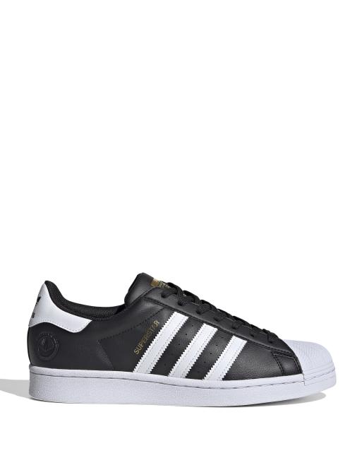 adidas Originals Superstar trainers in black and white