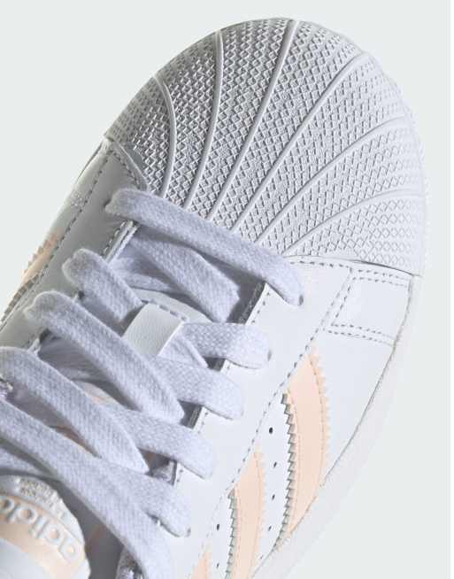 Peach and 2024 white adidas superstars