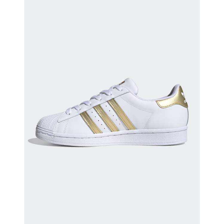 Adidas white & sale gold superstar trainers