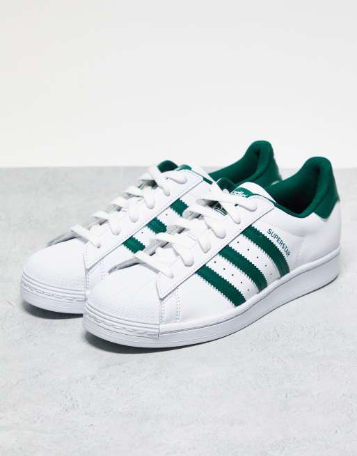 adidas Originals Superstar trainers in white and green