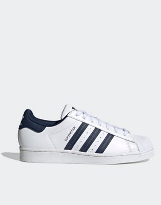 adidas Originals Superstar trainers in white and navy