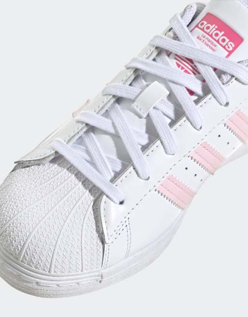 adidas Originals Superstar trainers in white and pink