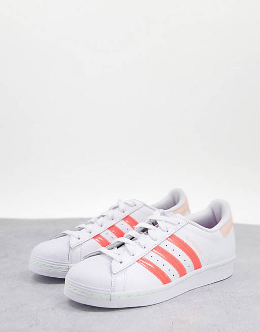 adidas Originals Superstar trainers in white & pink