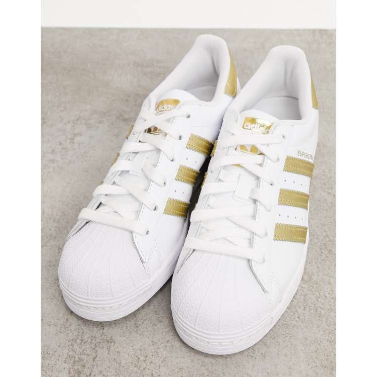 Adidas white shop gold shoes