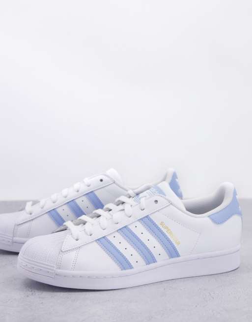 adidas Originals Superstar trainers in white with light blue stripes | ASOS