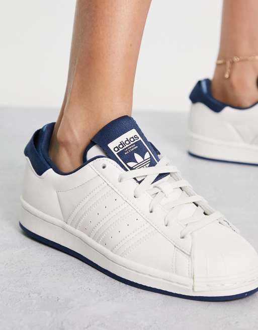 adidas Originals Superstar trainers in white with navy details