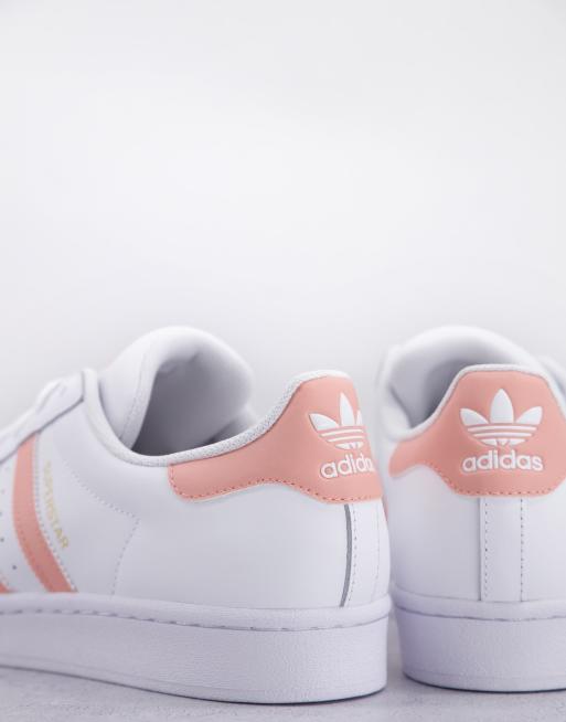 adidas Originals Superstar trainers in white with pink stripes