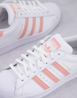 Pink and white adidas superstars online