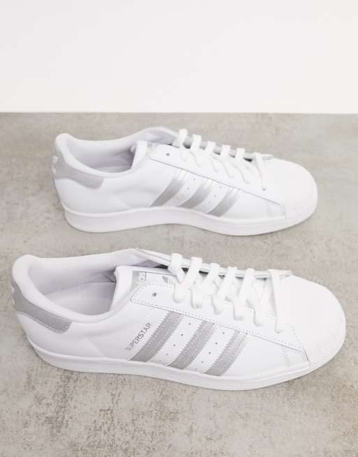 adidas Originals Superstar trainers in white with silver stripes