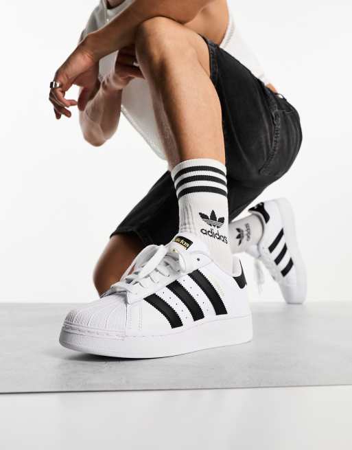 Adidas superstar black outlet and white high top