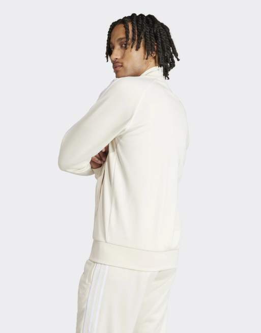 adidas Originals Superstar zip through track top in white and beige