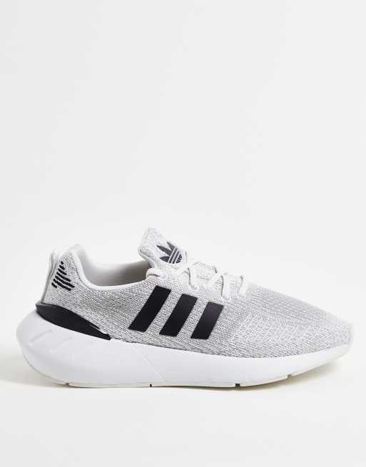 White adidas shoes with hotsell black stripes