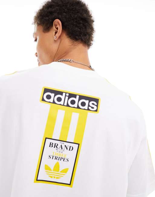 adidas Originals T shirt bianca e gialla con logo ASOS