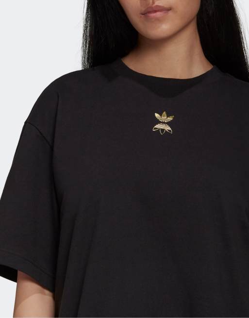 Black adidas shirt with gold outlet logo