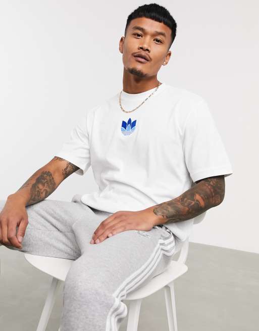 white adidas shirt with blue logo