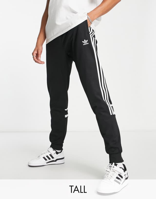 adidas Originals Tall adicolor Challenger three stripe slim fit sweatpants in black