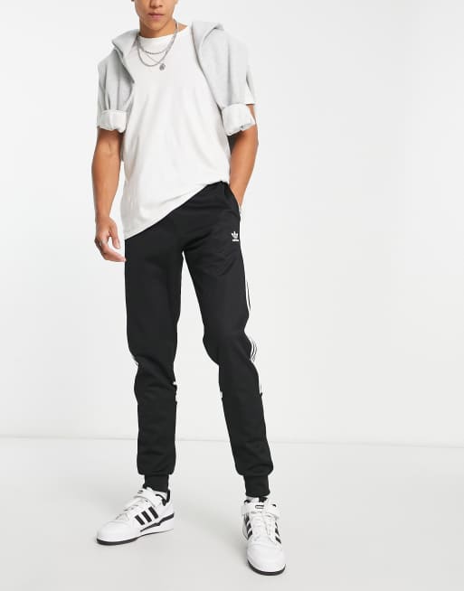 adidas Originals Tall adicolor Challenger three stripe slim fit sweatpants in black