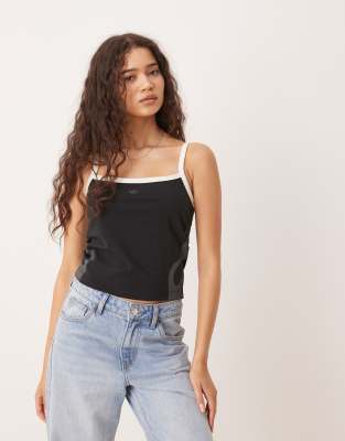adidas Originals - Tanktop in Schwarz und Wollweiß mit Flammenmotiv