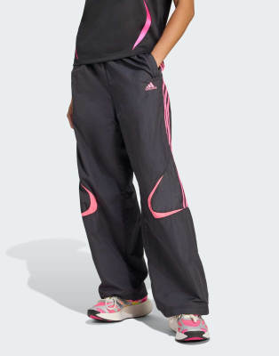 adidas Originals - Teamgeist Adicolor - Oversize-Trainingshose in Schwarz/Semi Lucid Fuchsia