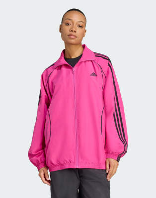 adidas Originals - Teamgeist adicolor - Veste de survêtement tissée oversize - Fuchsia semi-lucide/noir-rose