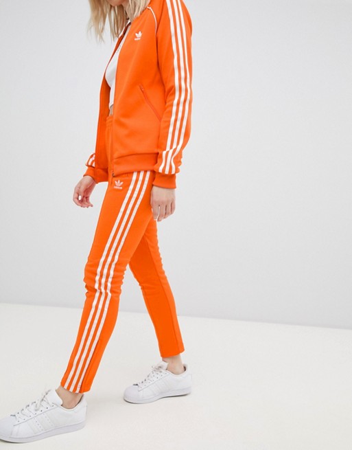 Adidas Originals Three Stripe Cigarette Pants In Orange | ASOS