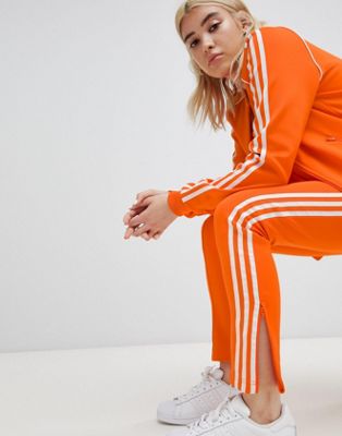 adidas originals three stripe cigarette pants in orange