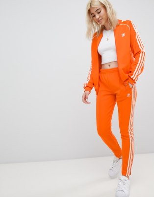 adidas originals three stripe cigarette pants in orange