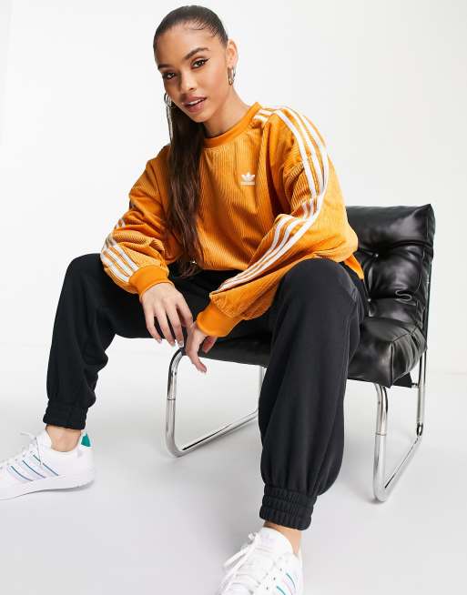 bruger storm hud adidas Originals three stripe corduroy sweatshirt in orange | ASOS