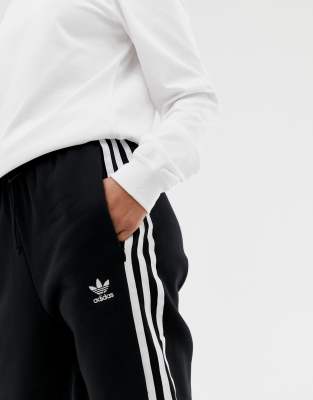 adidas originals three stripe cuffed sweat pants in black