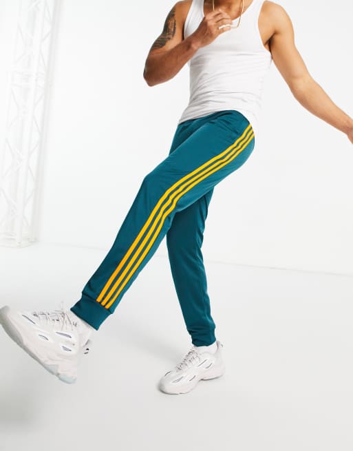 green sweatpants with red stripe