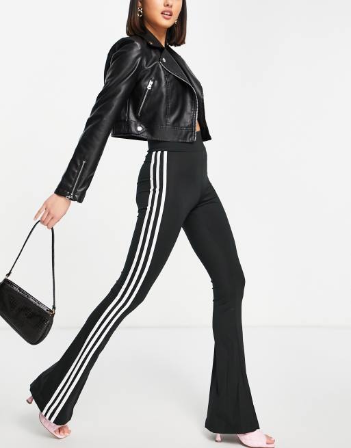 adidas Originals three stripe flared track pant in black