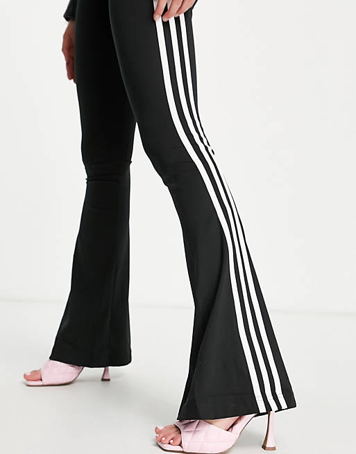 adidas Originals three stripe flared track pant in black