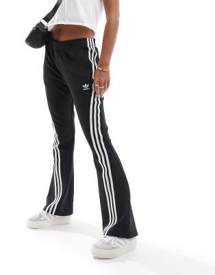 adidas Originals three stripe flared track pants in black - ASOS Price Checker