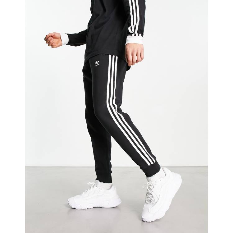 adidas Originals three stripe joggers in black ASOS