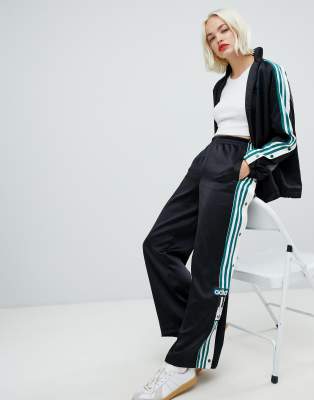 adidas originals three stripe popper pant with vintage logo in black