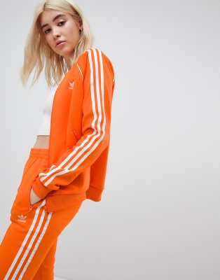 adidas originals three stripe track jacket in orange