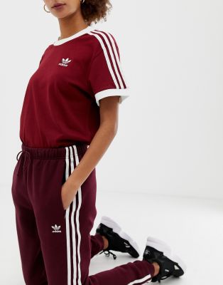 adidas originals three stripe track pants in burgundy