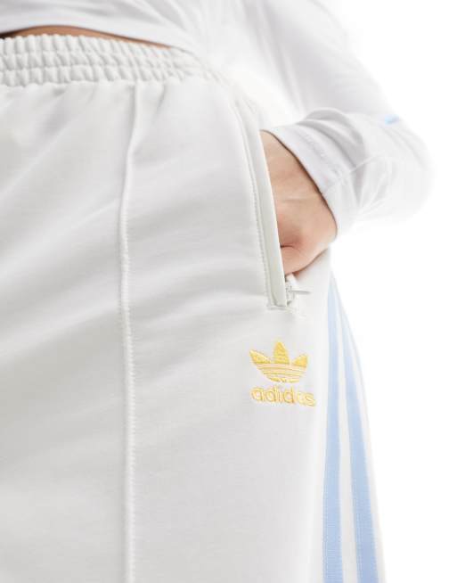 adidas Originals three stripe track pants in off white and blue