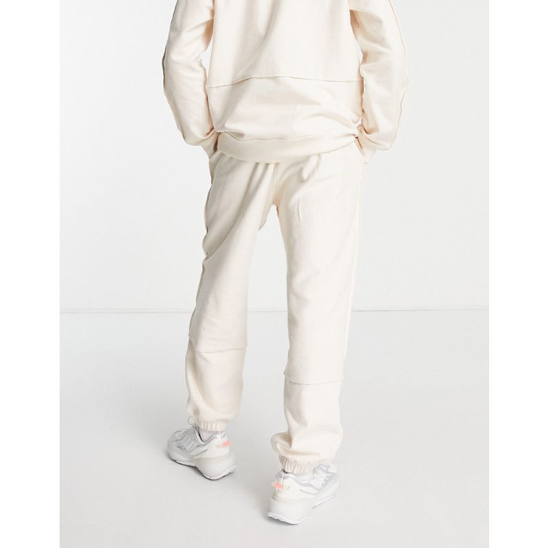 Pantaloni e leggings Activewear adidas Originals - Tonal Textures - Joggers in spugna bianco sporco