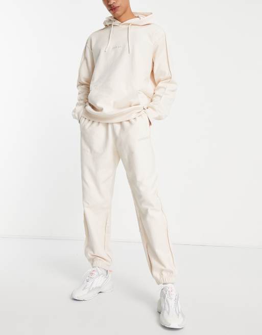 adidas Originals - 'Tonal Textures' - Joggingbroek van badstof in gebroken wit