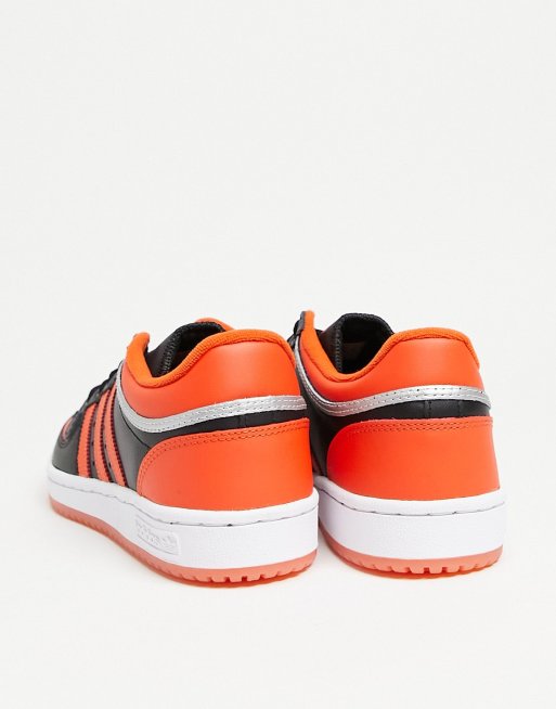 adidas Originals Top Ten low sneakers in orange and black