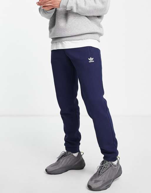 adidas Originals Trefoil Essentials logo trackies in navy | ASOS